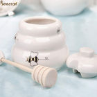 Honey Jar Ceramic Honey Pot vacío blanco al por mayor con el cazo de madera para el almacenamiento de la miel