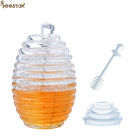 Dos tipos pote y cuchara transparentes de la miel de la abeja con el revolvimiento tarro cristalino de la miel de Rod del mini