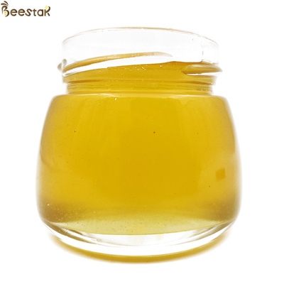 comprar Miel crudo puro Naturaleza Miel de flores de madera de frutas Sin adicción Color amarillo brillante 100% Miel de abeja natural fabricación en línea