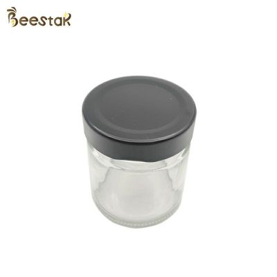 comprar botella de 250ml Honey Jar And Spoon Glass para Honey Packaging fabricación en línea
